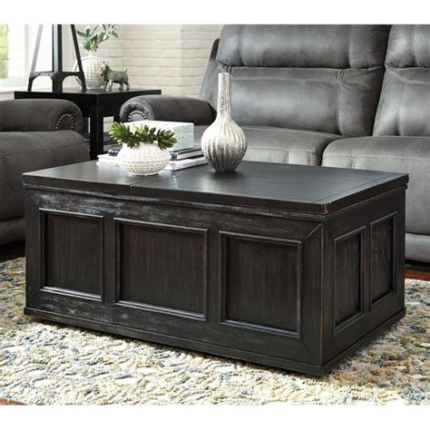 The gerdanet cocktail table offers a fresh take on urban style with a casual lift top design and replicated butcher block finish. Ashley Gavelston Lift Top Coffee Table in Rubbed Black ...