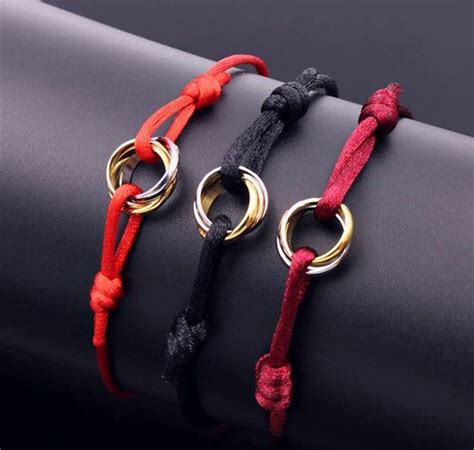 CARTIER TRINITY BRACELET WITH SILK ROPE ADJUSTABLE