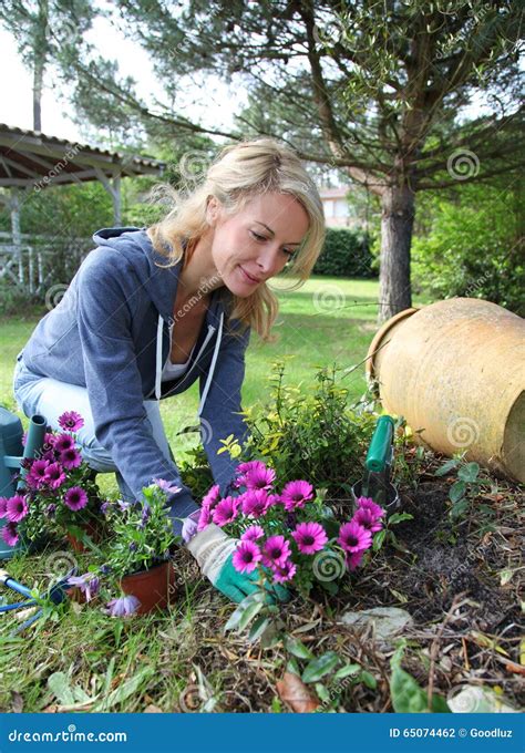 Mature Blond Woman Gardening At Home Stock Photo Image Of Private
