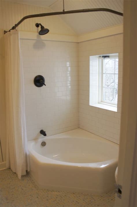 But, to keep it as functional as stylish, you can use corner tubs for small bathrooms. corner tub | corner tub with shower curtain | 'Round the ...