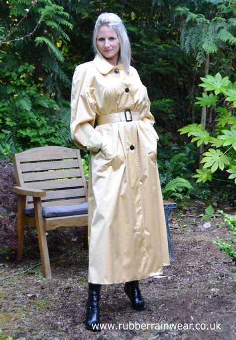 a very chic caroline in her magnificent golden rubberized satin mack leather coat leather and