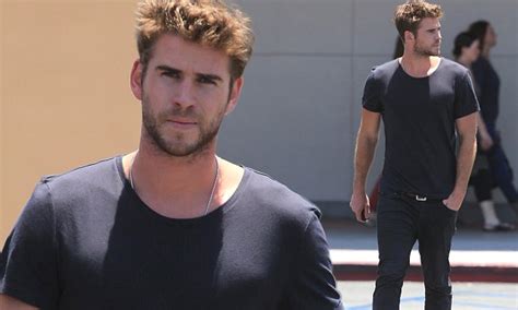 Liam Hemsworth Proudly Shows Off His Toned Torso In A Tight T Shirt