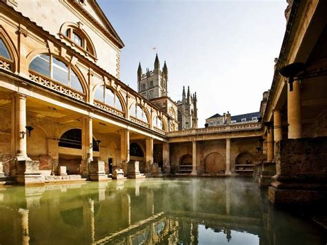 Roman Baths With Bath Abbey Reflection In Bath England