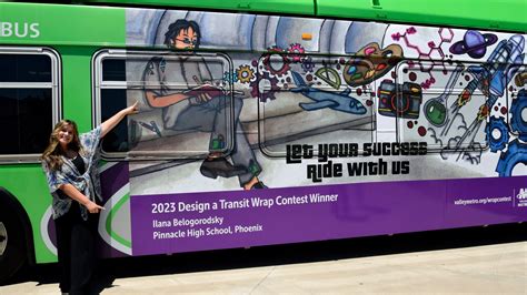 Ilana Belogorodsky Showing Off Her Winning Design On A Valley Metro Bus