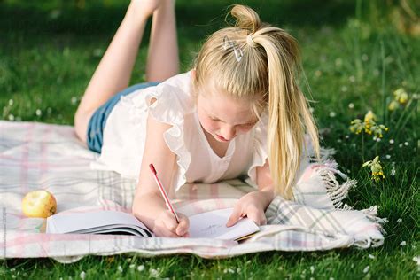 Tween Girl Drawing Outdoors In Early Summer By Helen Rushbrook