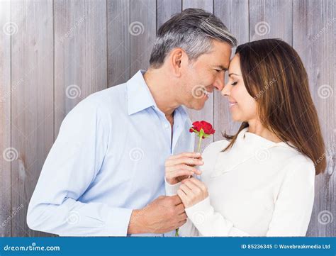 Mature Man Giving Red Rose To Woman Stock Image Image Of Cheerful