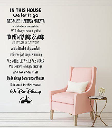 A Pink Chair Sitting In Front Of A Wall With The Words In This House On It