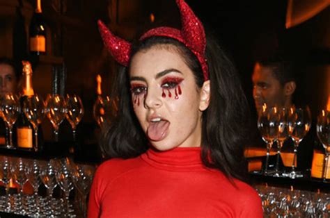 saucy devil charli xcx flashes nipple pasties in see through red dress daily star