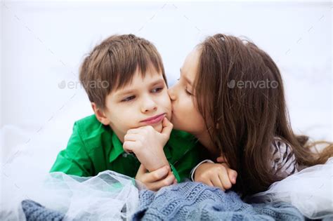 Little Girl Kissing Boy On The Lips