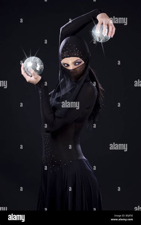 Party Dancer In Ninja Dress With Disco Balls Stock Photo Alamy