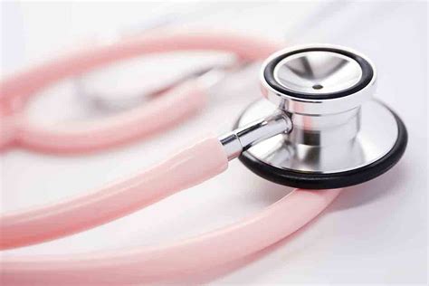 Close Up Of Pink Stethoscope On White Background Stockfreedom