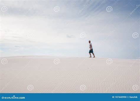 Lost In The Desert Is Walking Along The Dune Stock Photo Image Of