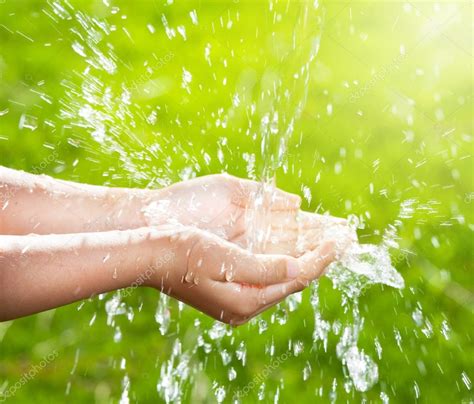Stream Of Clean Water Pouring Into Childrens Hands Stock Photo By