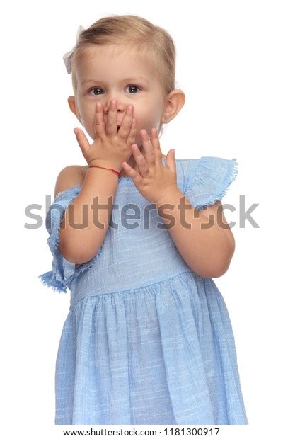 Smiling Little Girl Covering Her Mouth Stock Photo 1181300917