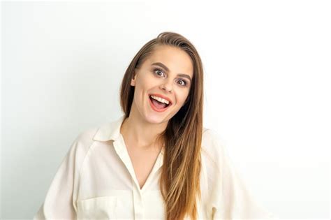 Premium Photo Portrait Of A Young Caucasian Happy Woman Wearing White Shirt Smiling With Open