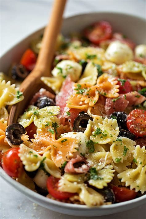 A simple pasta salad with mozzarella and veggies plus an easy italian dressing. Zesty Italian Pasta Salad - Life Made Simple