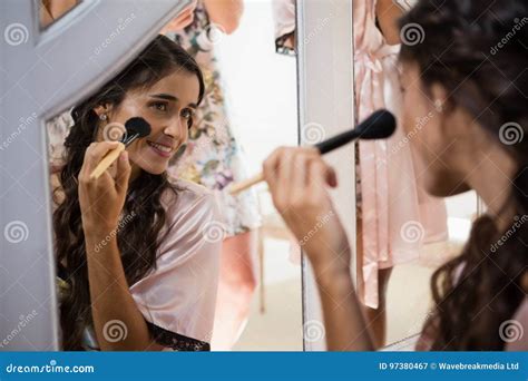 Bride Applying Her Makeup Doing Her Wedding Preparation Stock Image