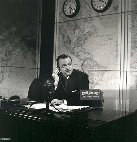 american broadcast journalist walter cronkite sits behind a desk and nachrichtenfoto getty