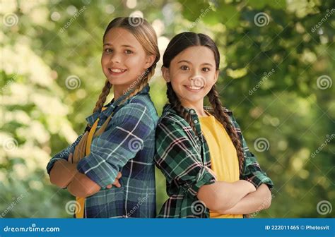Happy Cute Girls Friends Smile In Casual Fashion Style Keeping Arms Crossed Summer Landscape
