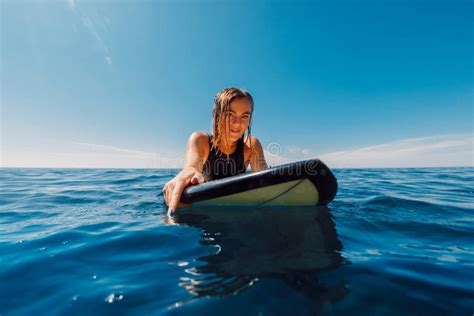 Portrait Of Surf Girl On Surfboard Beautiful Blonde Woman Look At Camera On Line Up Surfer In