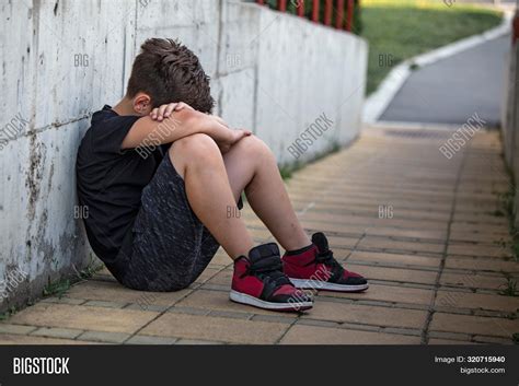 Little Boy Sad Sitting Image And Photo Free Trial Bigstock