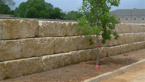 How to install natural stone retaining wall. Quarry Block Retaining Wall | Retaining wall blocks, Boulder retaining wall, Stone walls garden