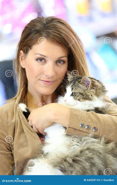 Portrait Of Woman Holding Cat In Her Arms Stock Photo Image Of
