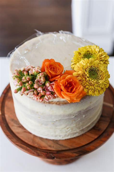 There Is A White Cake With Flowers On It