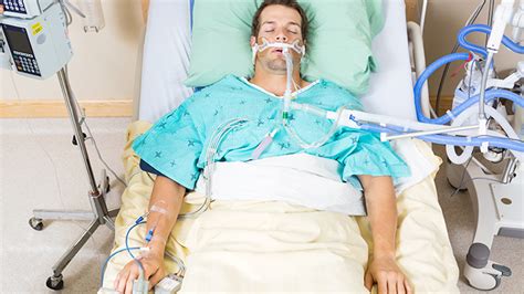 Patient On Ventilator In Hospital Bed