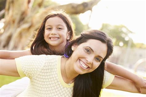 portrait of hispanic mother and daughter in park stock image image of camera people 55902089