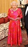 Queen Elizabeth II Wears Pink Gown, Gold Handbag: Pics