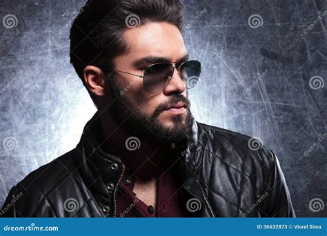 Side View Of A Young Man With Long Beard In Sunglasses Stock Image