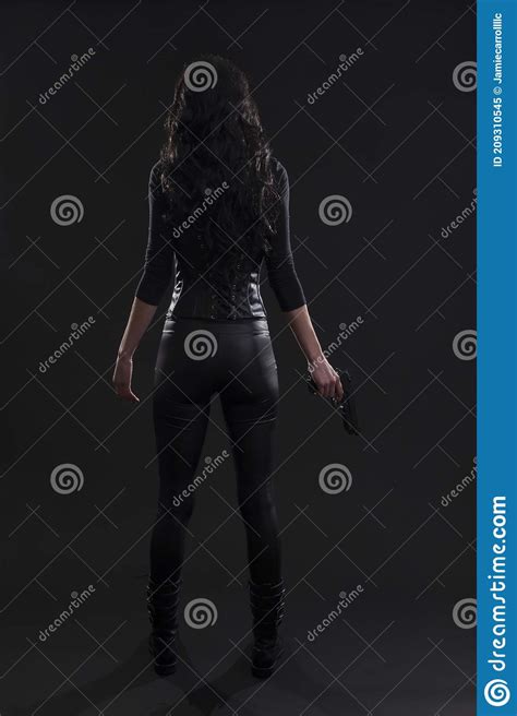 Killer Female Assassin Holding A Gun Wearing Black Leather Stock Image Image Of Neutral