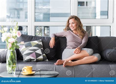 Smiling Woman Resting On Cozy Sofa Stock Image Image Of Full Female 101498305