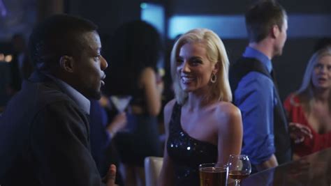 Two People Talk And Flirt While Standing At The Bar In A Club Stock Footage Video 4992347
