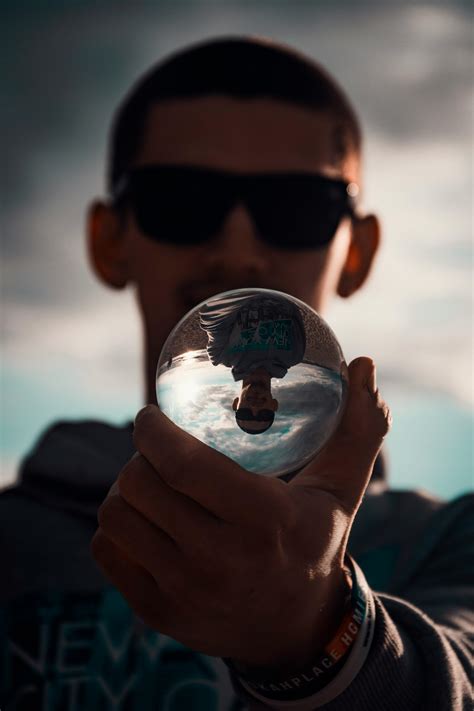 Person Holding Crystal Ball · Free Stock Photo