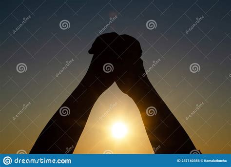 Human`s Hand Praying Meditating In Harmony And Peace At Sunset