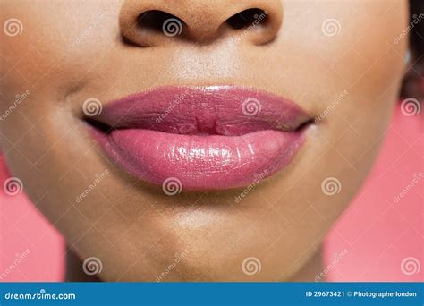 Close Up View Of An African American Womans Lips Over Colored