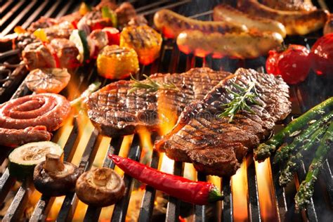 Delicious Grilled Meat With Vegetables Sizzling Over The Coals On