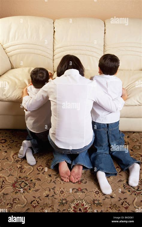 Mother Praying With Her Sons Stock Photo Alamy