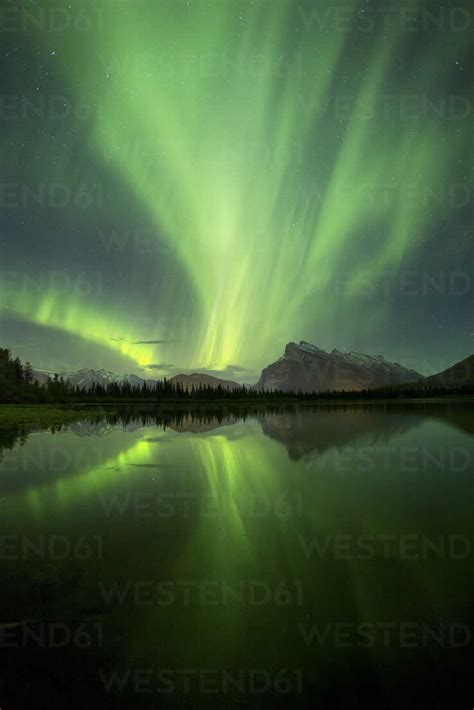 Aurora Borealis Over Lake And Mountains In Banff National Park Alberta