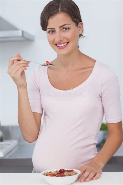 Pregnant Woman Eating A Bowl Of Cereal Stock Image Image Of Homey Female 32512471