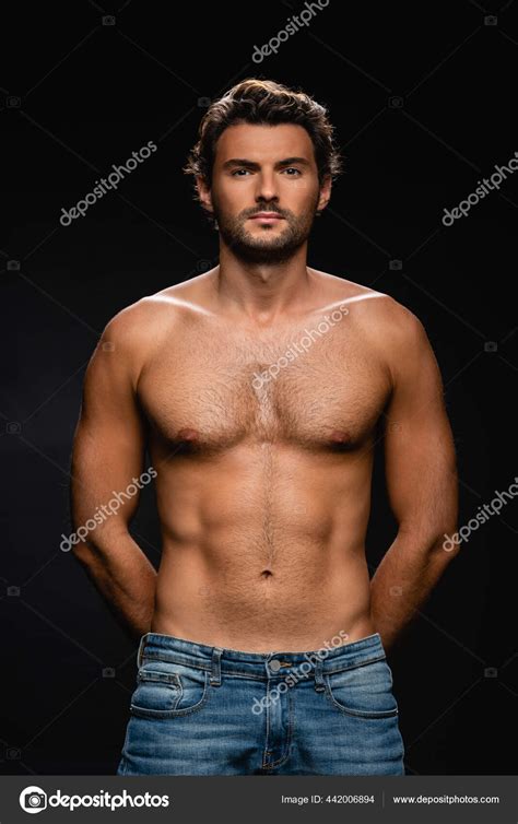 Sexy Shirtless Man Looking Camera While Posing Hands Back Black Stock