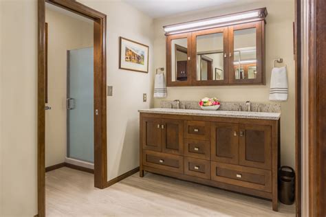 The bathroom vanity pictured is actually a kitchen or utility cabinet they used to sell. Wood Vanity, Medicine Cabinet & Mirror Care and Installation