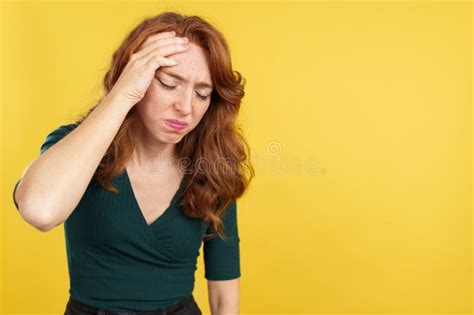 Beauty Redheaded Woman Gesturing Headache With The Hand On Head Stock Image Image Of Ache
