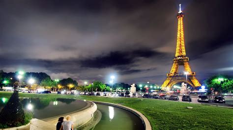 Yellow Lighting Paris Eiffel Tower With Shallow Background Of Dark Sky