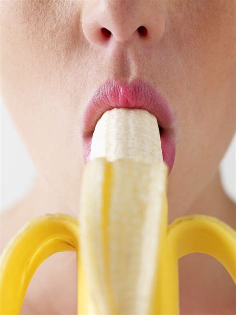 A Woman Eating A Banana License Images 688990 Stockfood