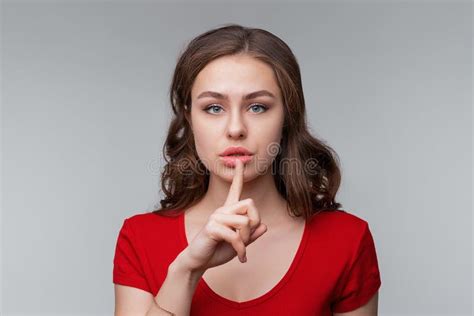 Keep It Quiet Serious Young Brunette Woman Holding Finger On Mouth Making Hush Silence Shh