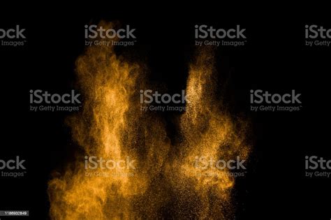 Yellow Dust Particles Explosion On Black Backgroundyellow Powder Splash