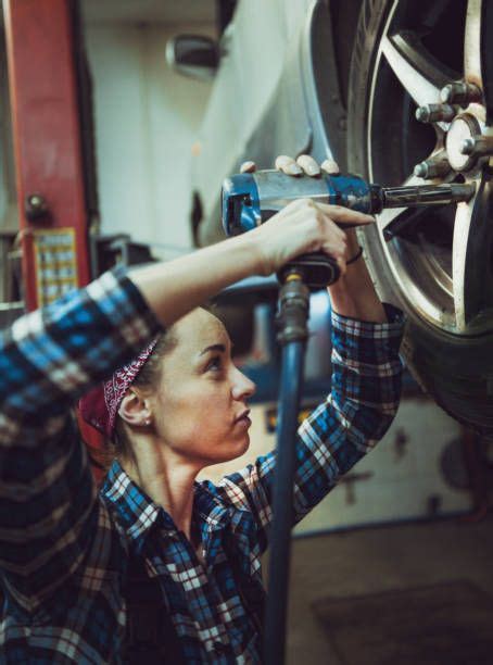 Female Mechanic Working On Car Tyre Service Woman Mechanic Mechanics